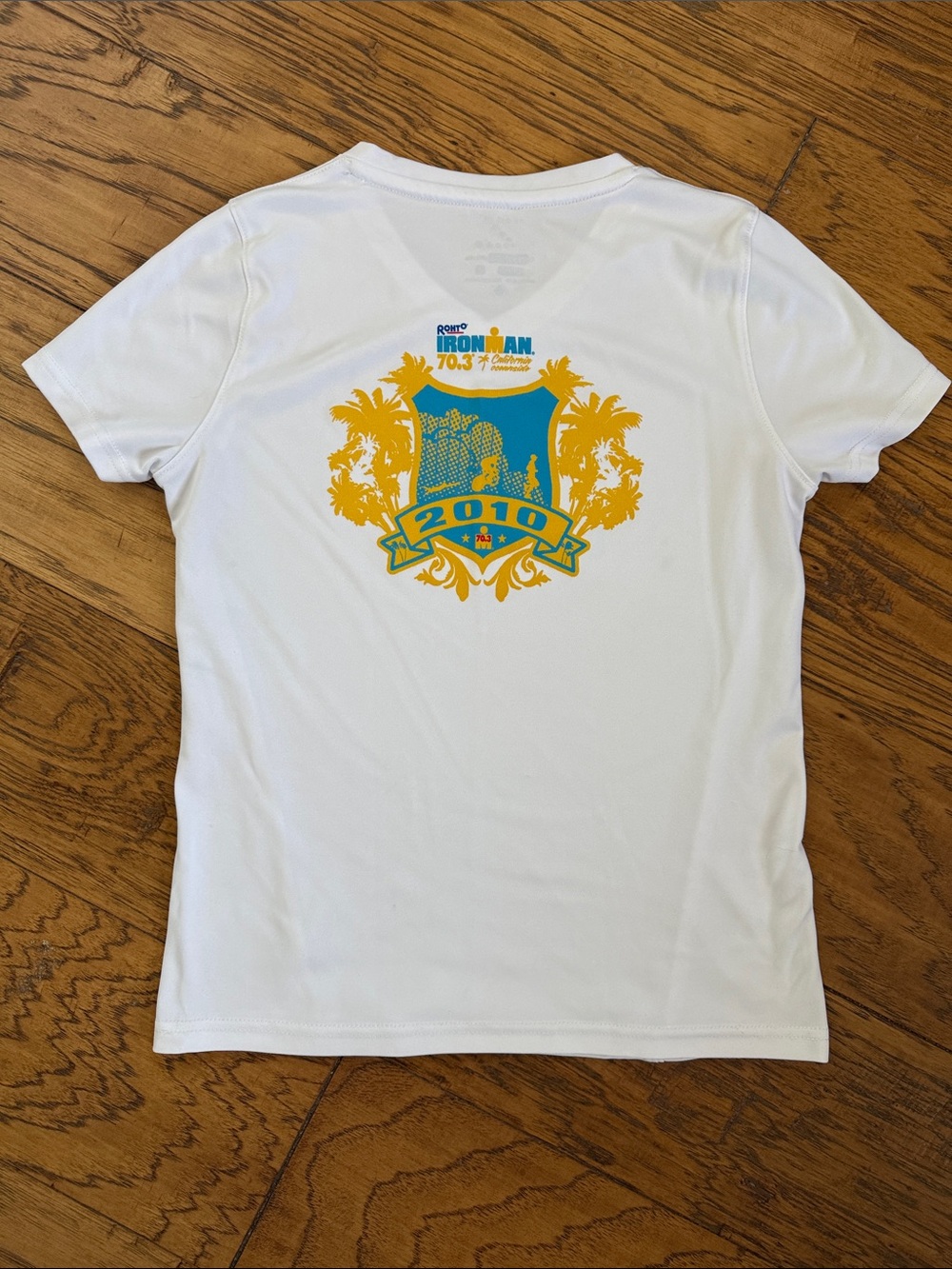 IronMan White Zorrell V-Neck Short Sleeve Women's Tee with Blue and Yellow Logo